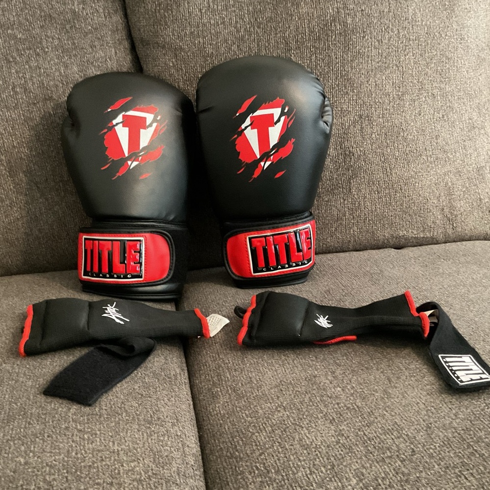 Black and Red Boxing Gloves with Secure Wrist Straps